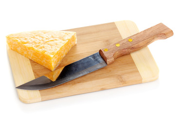Cheese on cutting board with knife isolated on white