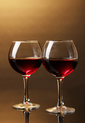 Wineglasses on brown background