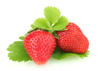 sweet ripe strawberries with leaves isolated on white