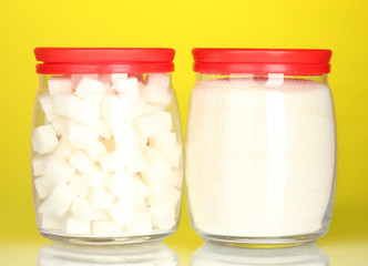 Jars with white lump sugar and white crystal sugar