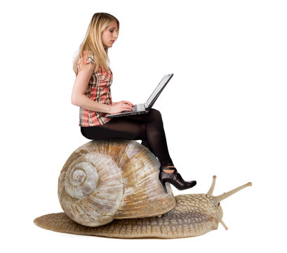 Attractive blond girl with laptop riding on speedy snail