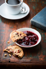 Cranberry cookie and sour cherry jam on a rustic table