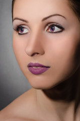 Portrait of beautiful girl with violet eyes
