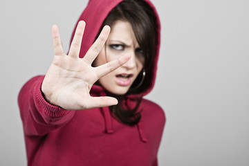 Hooded Teenage Girl Holding Hand Up