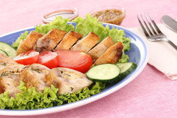 Tasty meat cutlet with garnish on plate