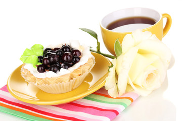 sweet cake with cup of tea isolated on white