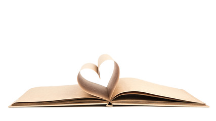 Book with opened pages of shape of heart isolated on white backg
