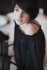 Sexy girl on suspenders smiling