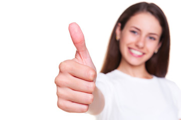 happy young woman showing thumbs up
