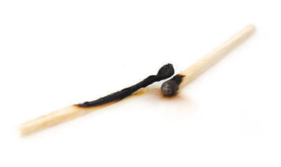 burned match on a white background