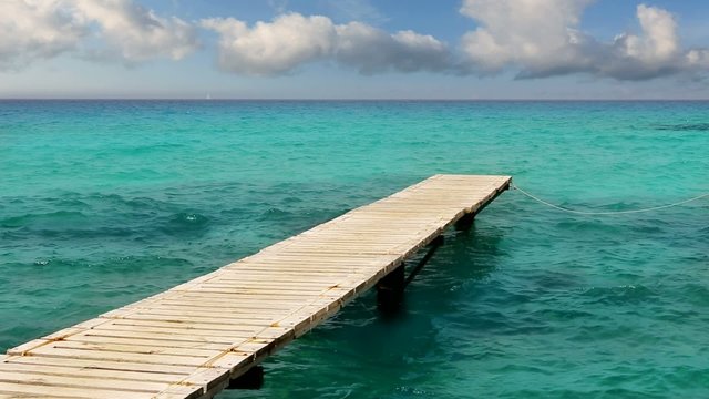 beach wooden pier turquoise sea Formentera Balearic islands