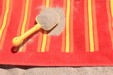 Beach sand on towel