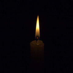 Fototapeta na wymiar candle on a black background