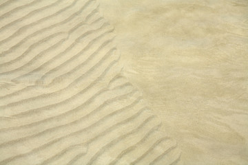 texture of the sand under the water.