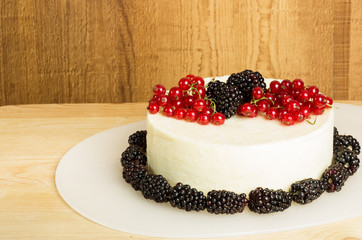 White cheddar cheese block with currants and blackberries