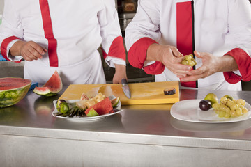 Two chefs at work in a restaurant