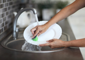 Cleaning dishware kitchen sink sponge washing dish