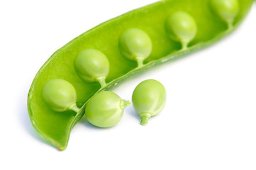 Fresh green peas isolated on white