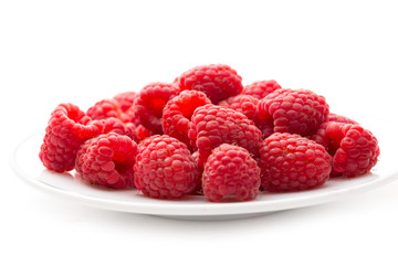 Fresh raspberry on white plate