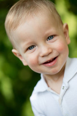 Child in white shirt outside