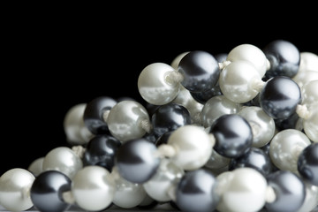 String of black and white pearls