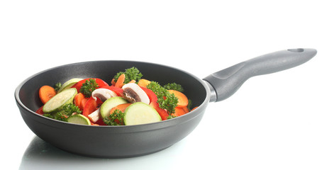frying pan with vegetables on white - obrazy, fototapety, plakaty