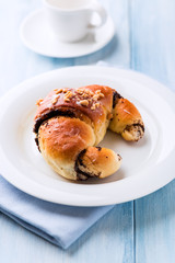 Sweet poppy seed croissant on a plate