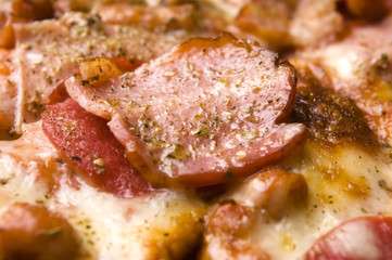 Italian pizza with bacon, salami and mozzarella cheese
