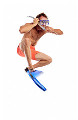 Caucasian swimmer wearing mask, snorkel and flippers jumping © Andrey Bandurenko