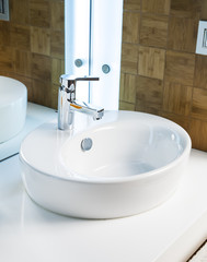 Modern bathroom sink in white ceramic