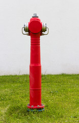 Standing red fire hydrant