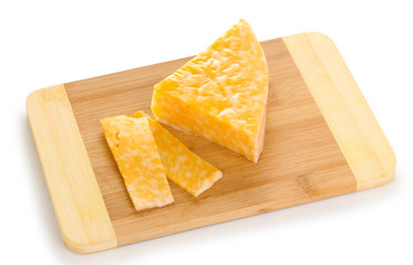 Cheese on cutting board isolated on white