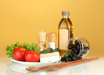 Ingredients for a Greek salad on brown background close-up