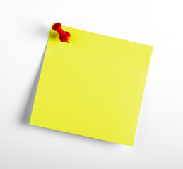 Yellow reminder note with red pin isolated