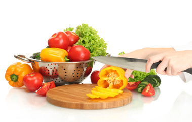 woman hands cutting vegetables on kitchen blackboard