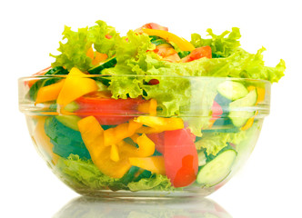 fresh vegetable salad in transparent bowl isolated on white