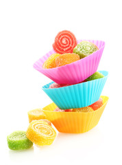 sweet jelly candies in cup cake cases isolated on white.