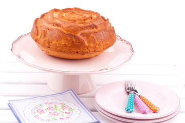 vanilla cake on a stand on a white background