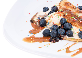 Vanilla Ice Cream decorated with Blueberries