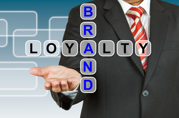 Businessman hand drawing Brand Loyalty