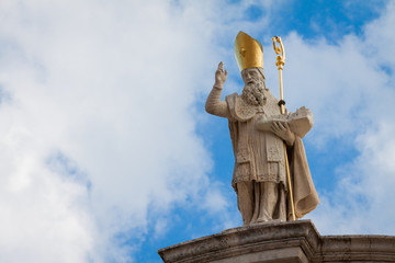 Naklejka premium A statue of St. Blaise holding a model of Dubrovnik