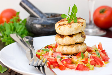 Grilled chicken cutlets with a salad of fresh vegetables