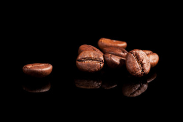 Luxurious coffee beans on black.