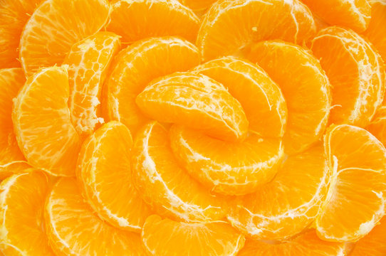 Many Orange Segments All Laid Out As A Background