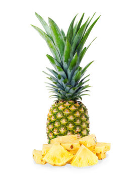 ripe pineapple with slices  isolated on white background