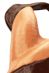 close-up view of flowing caramel chocolate twirl from below