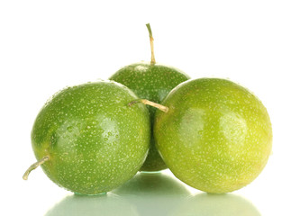 three green passion fruit isolated on white