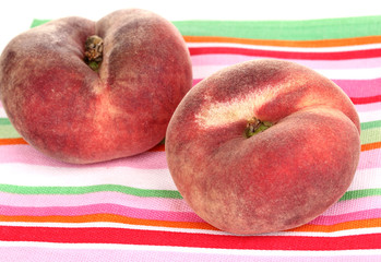 ripe fig peaches on napkin isolated on white.