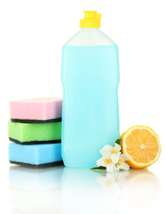 Dishwashing liquid with sponges and lemon with flowers