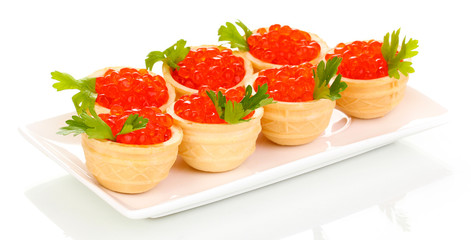 Red caviar in tartlets on white plate isolated on white